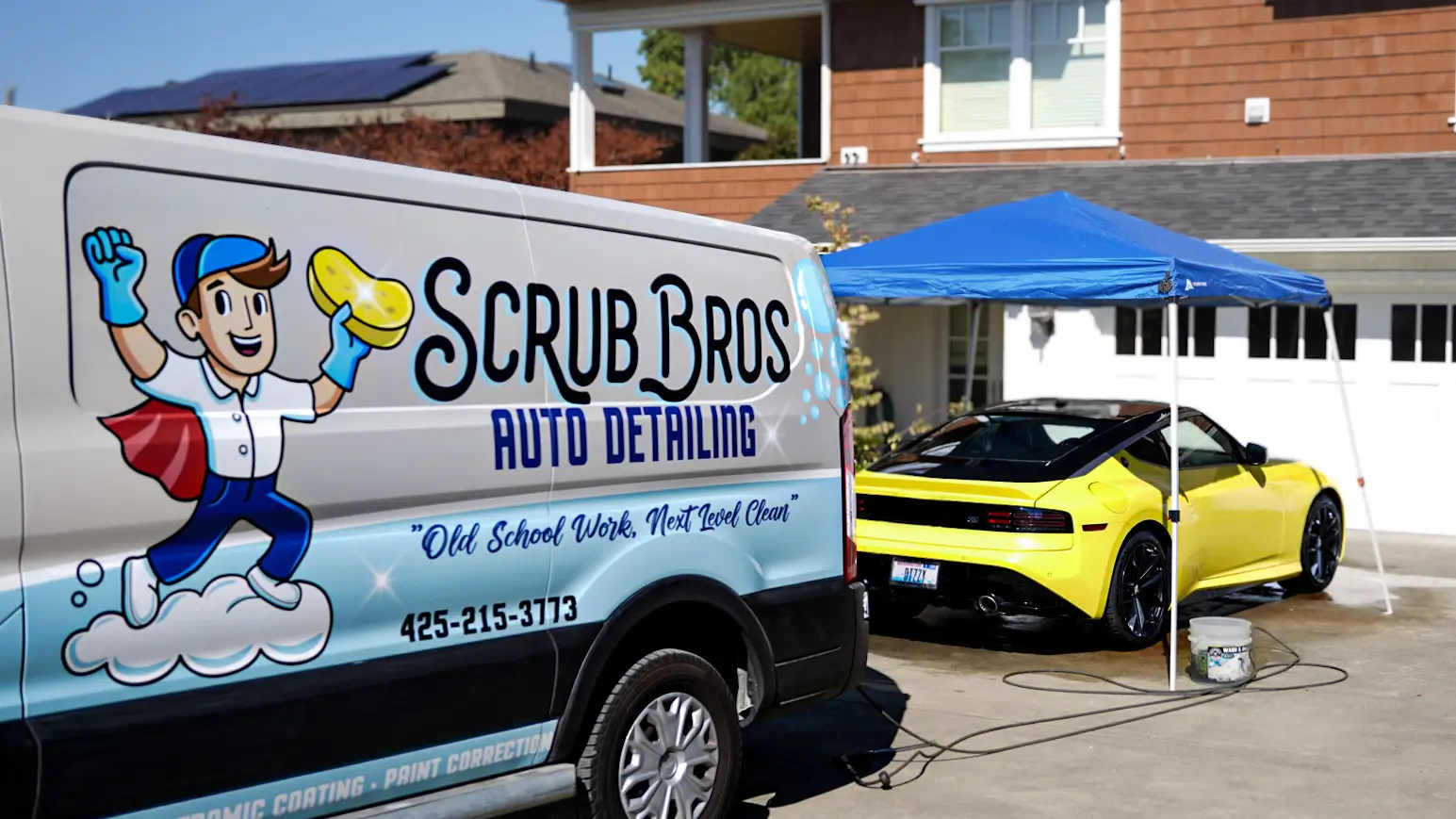 Scrub Bros van with yellow sports car