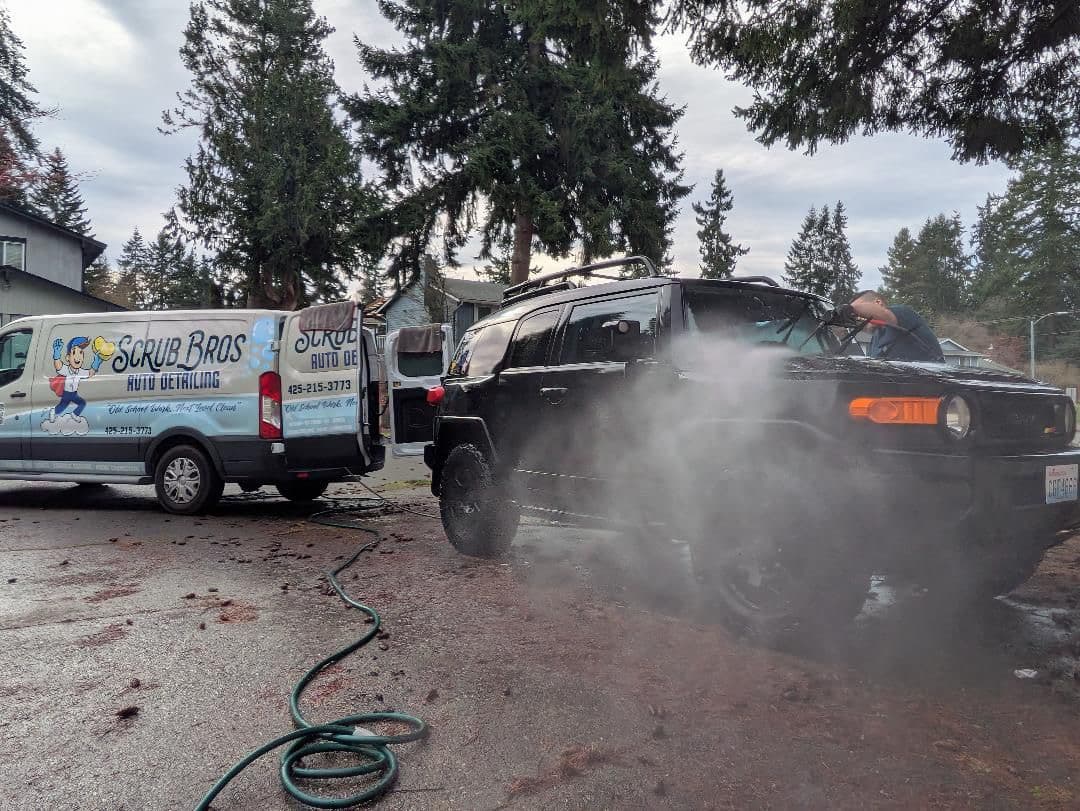 Scrub Bros van and team on-site detailing